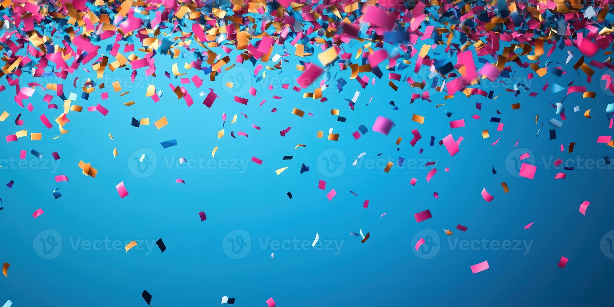 Bright confetti falling against a blue background during a festive celebration or party atmosphere photo
