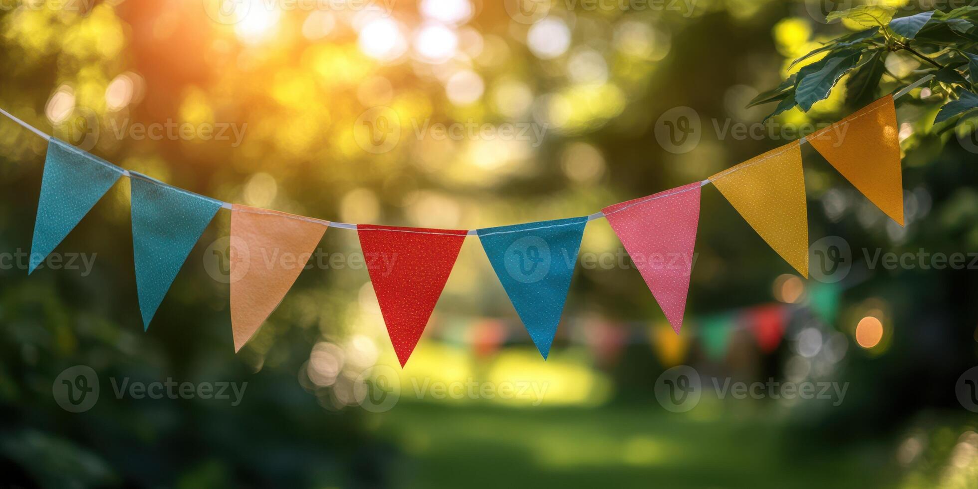 Colorful pennants sway gently in the breeze during a sunny garden celebration filled with joy and laughter photo