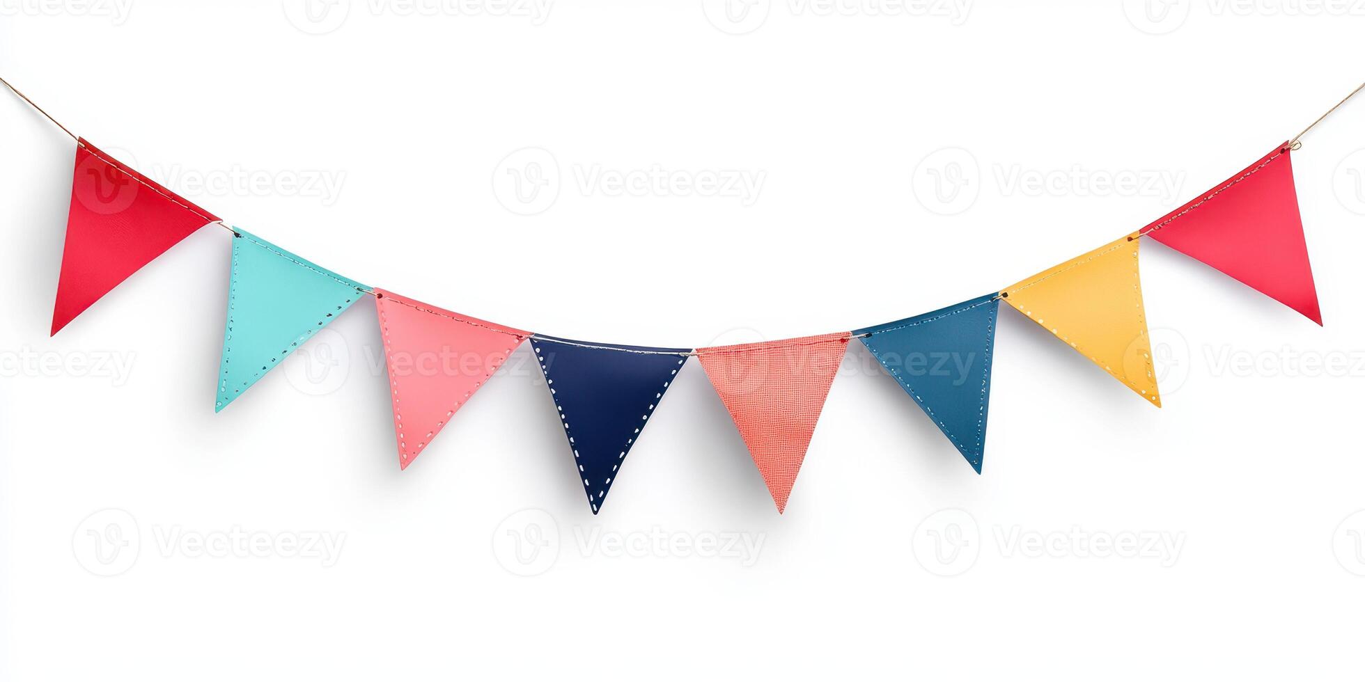 Colorful decorative bunting made of fabric hanging against a white wall for a festive event or celebration photo