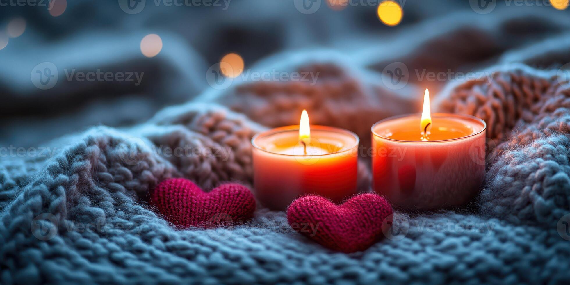 Cozy evening with lit candles and soft hearts on a knitted blanket during winter nights photo