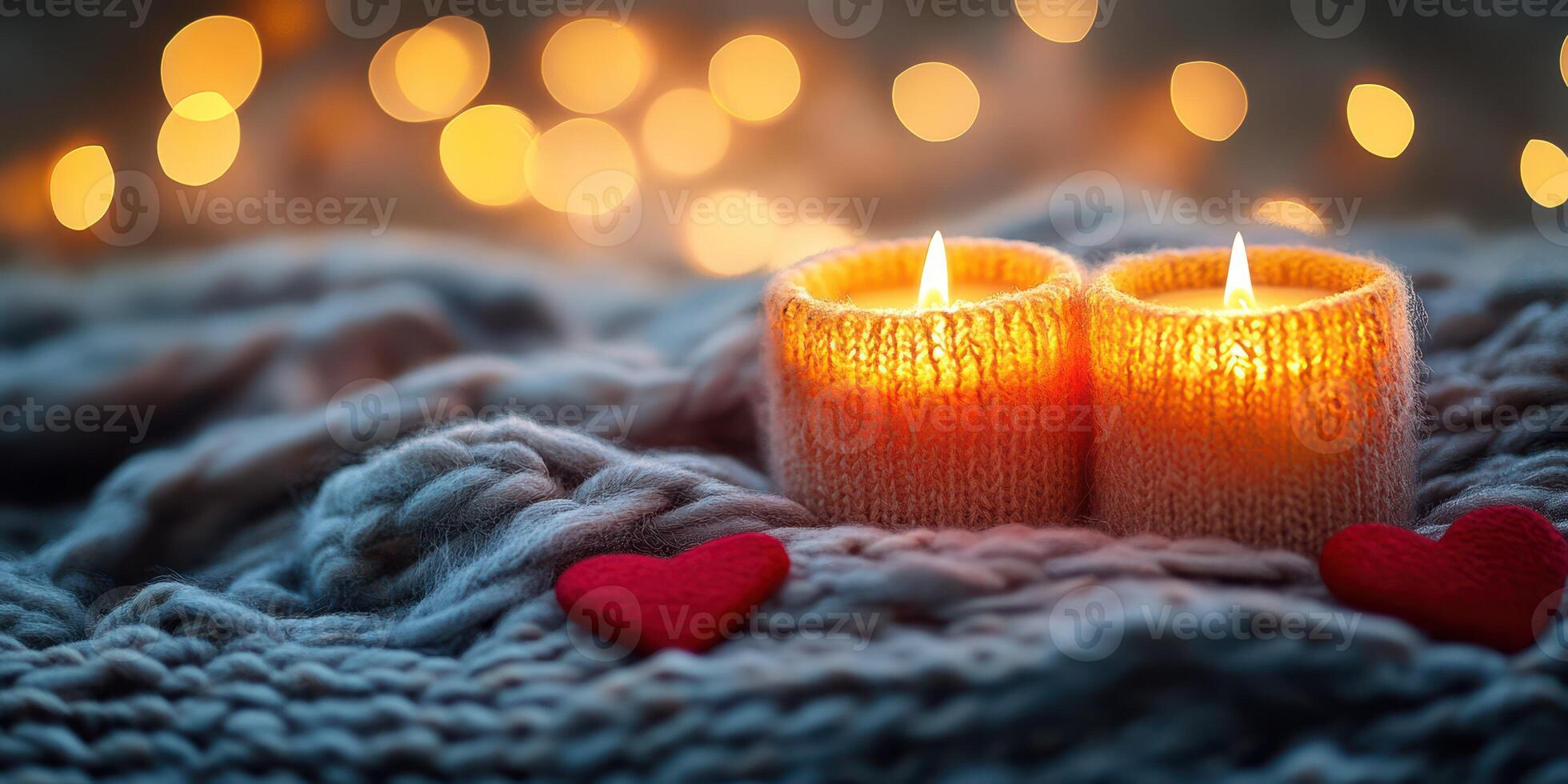 Cozy atmosphere with glowing candles and soft hearts on a knitted blanket during a relaxed evening photo