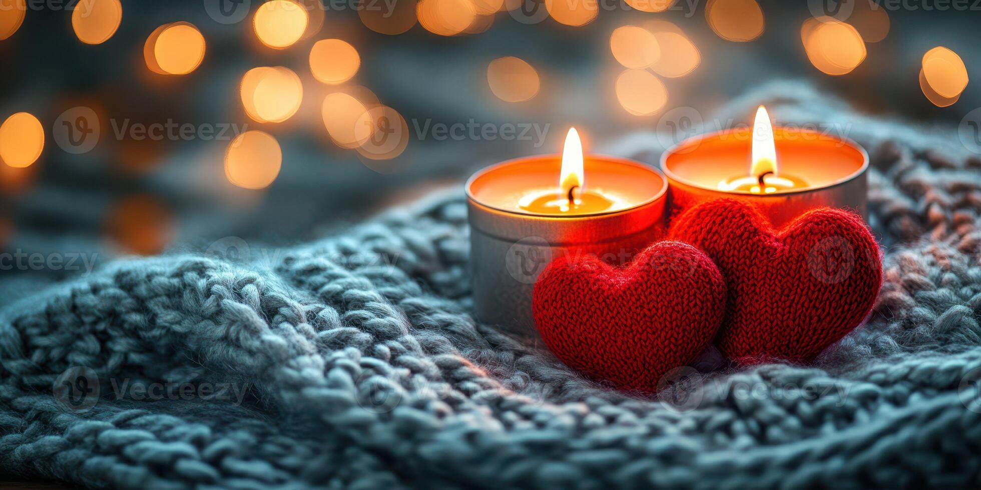 Decorative candles and knitted hearts create a cozy atmosphere for romantic evenings in a softly lit space photo