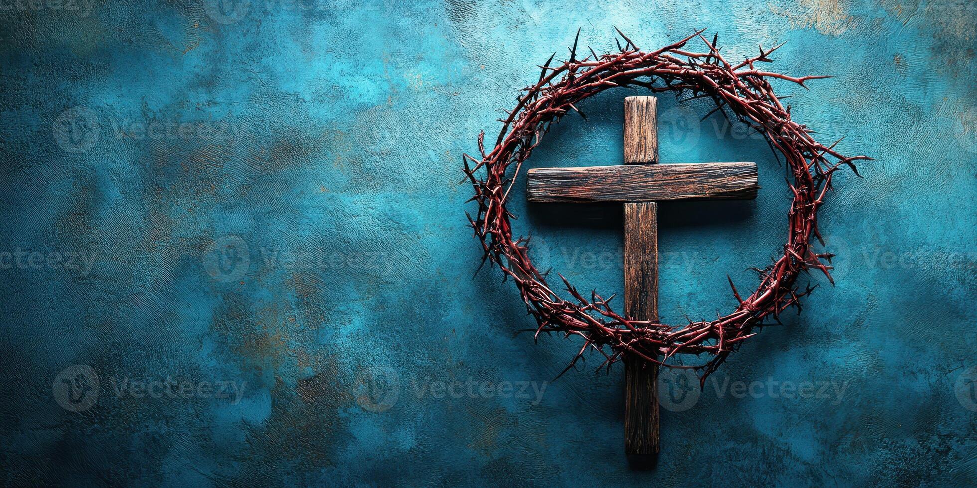 Cross with thorn crown displayed against a textured blue background in a spiritual setting photo