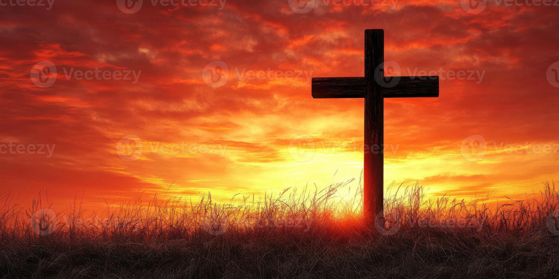 Cross silhouetted against a vibrant sunset sky with wispy clouds in a peaceful landscape photo