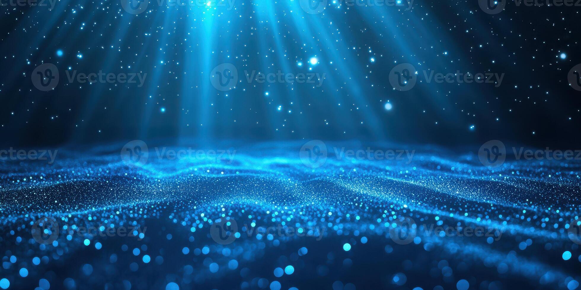 Glowing blue ocean waves illuminated by beams of light in a serene, tranquil underwater setting photo