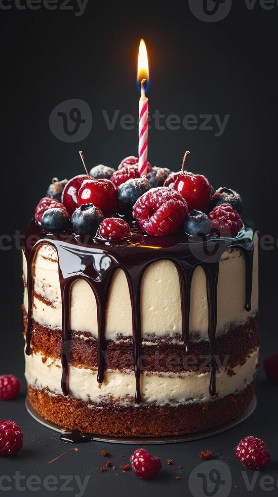 Delicious chocolate cake with berries and a candle celebrates a special occasion in a dark setting photo