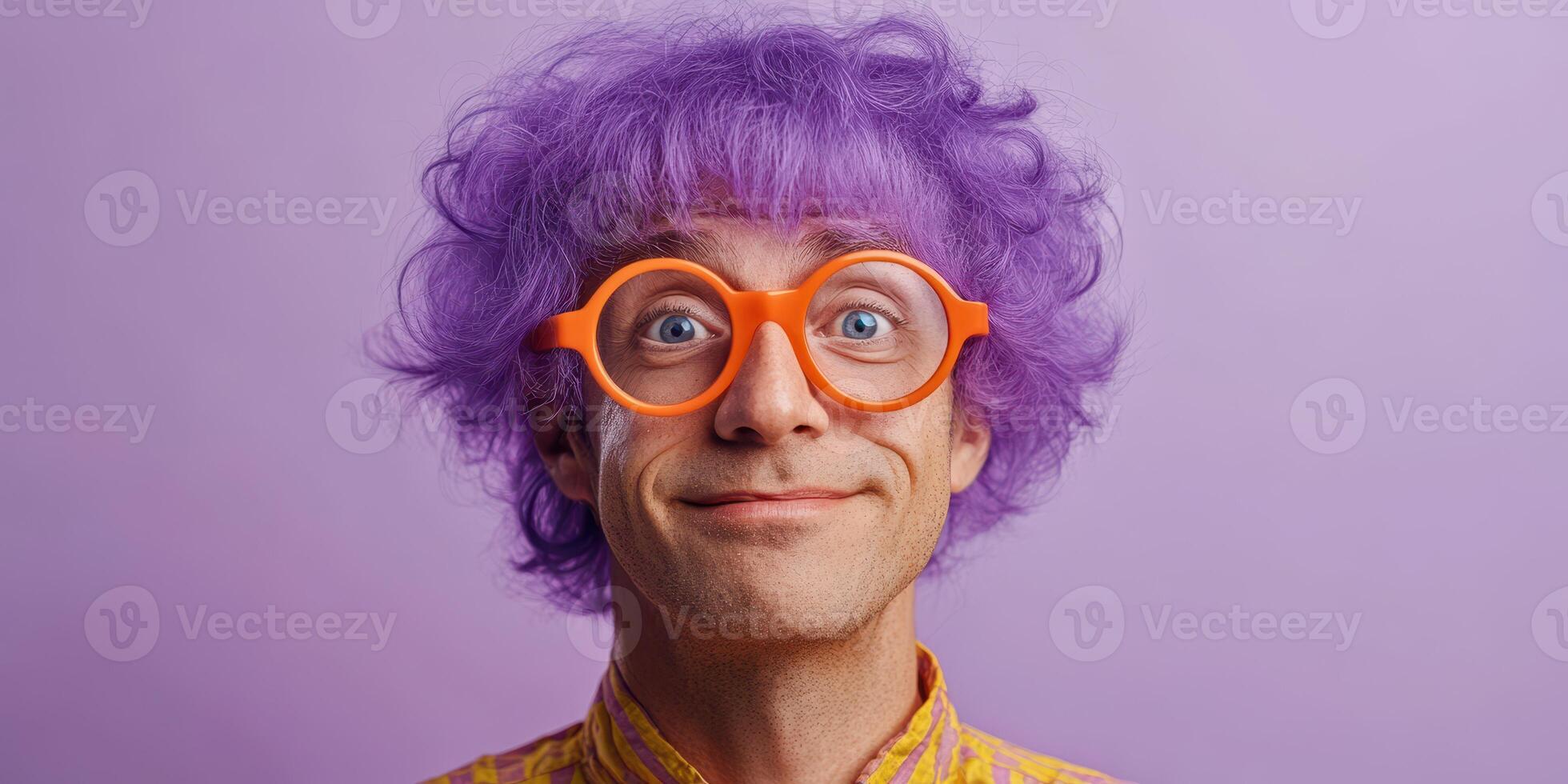 Colorful person with purple hair and orange glasses smiles against a purple background in a playful and vibrant setting photo