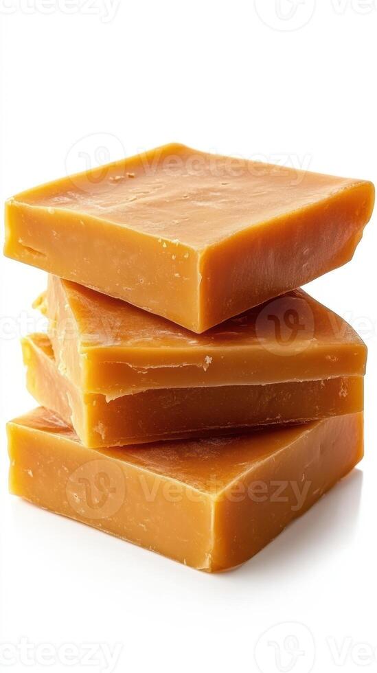 Handcrafted caramel soap bars stacked in a neat arrangement for an aesthetic display photo