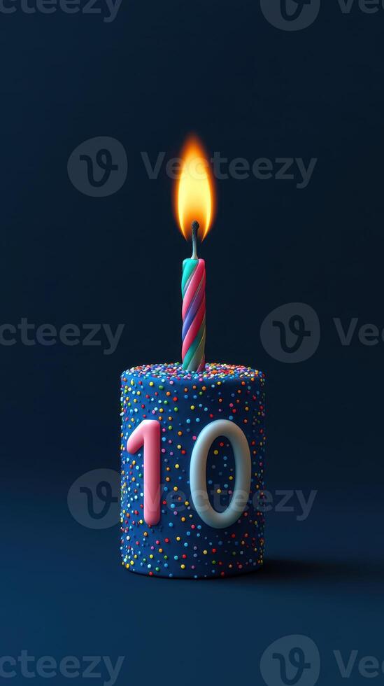 Colorful birthday cake with a single candle celebrating a child's tenth birthday photo
