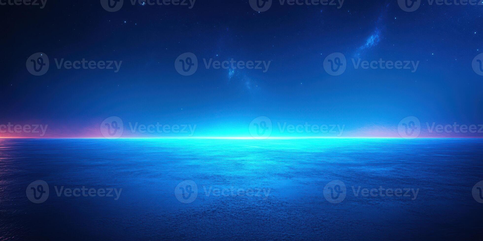 Vibrant twilight horizon over calm ocean with deep blue and purple hues illuminating the sky photo
