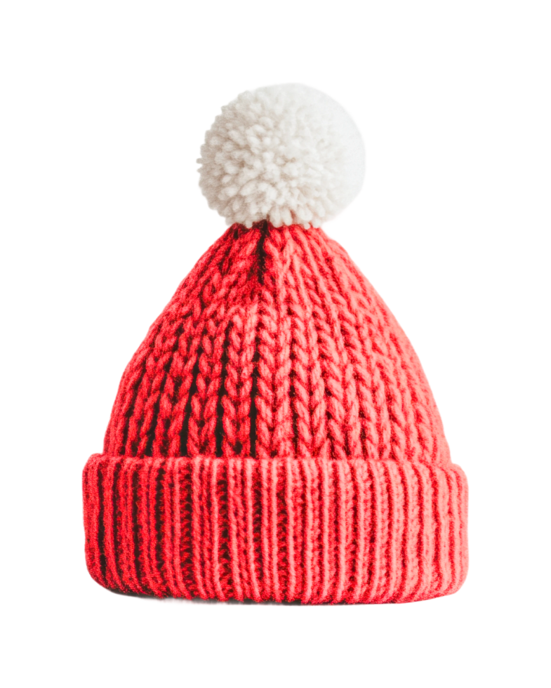 Red knitted beanie with white pom-pom on top for winter warmth and style, cut out png