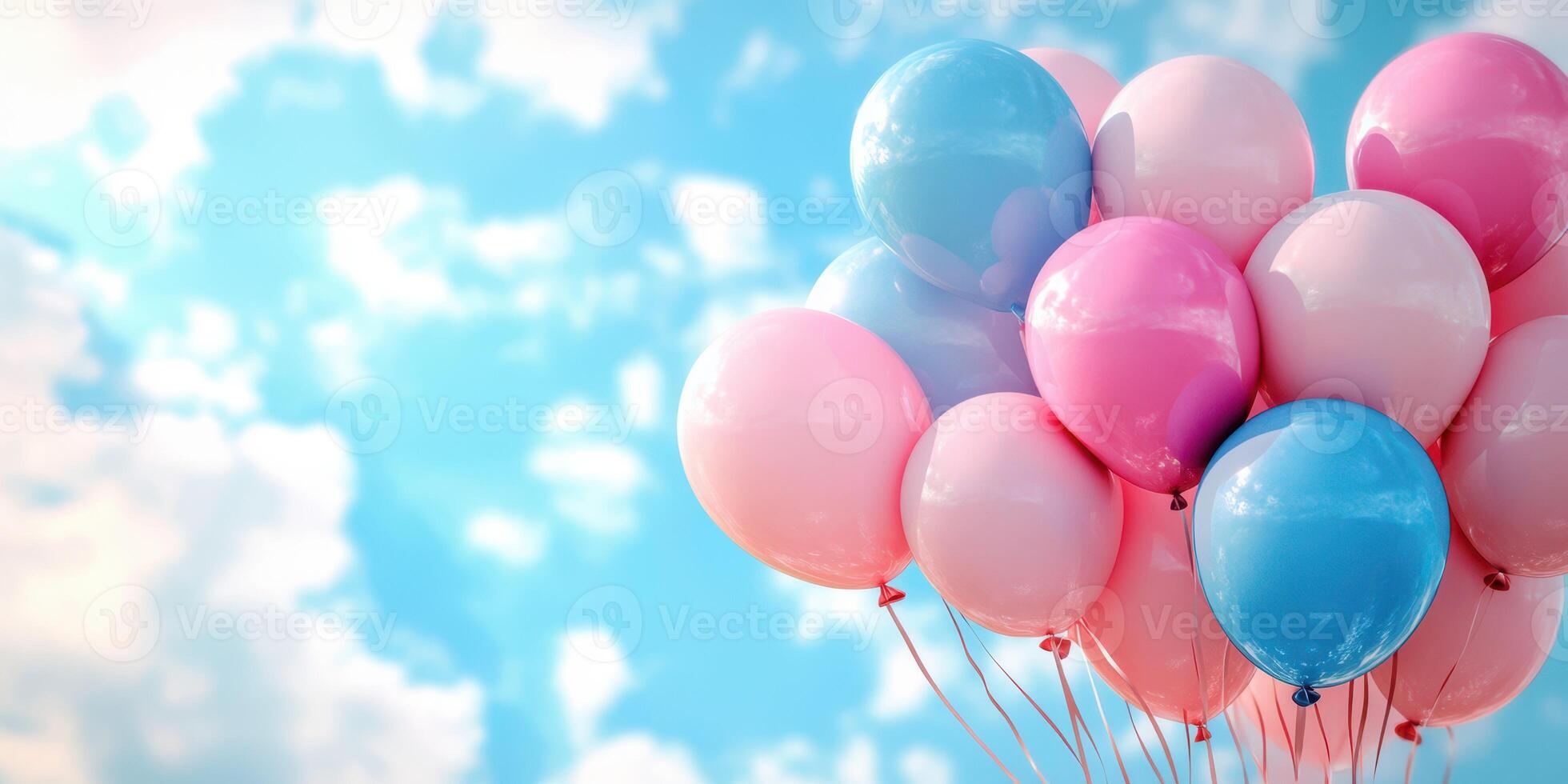 Colorful balloons float against a clear blue sky during a sunny day, creating a festive atmosphere photo