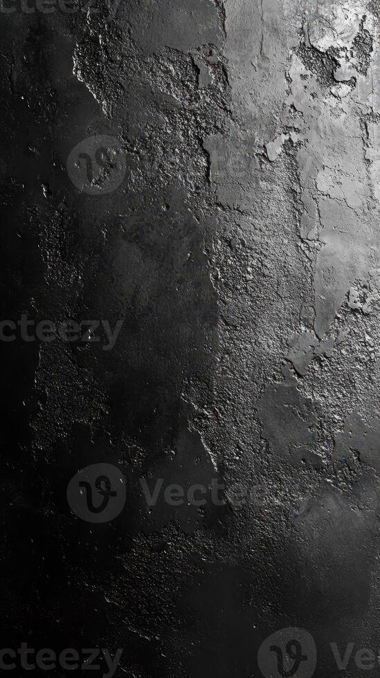Textured black surface with rough patches creates a bold artistic backdrop for creative designs and compositions photo
