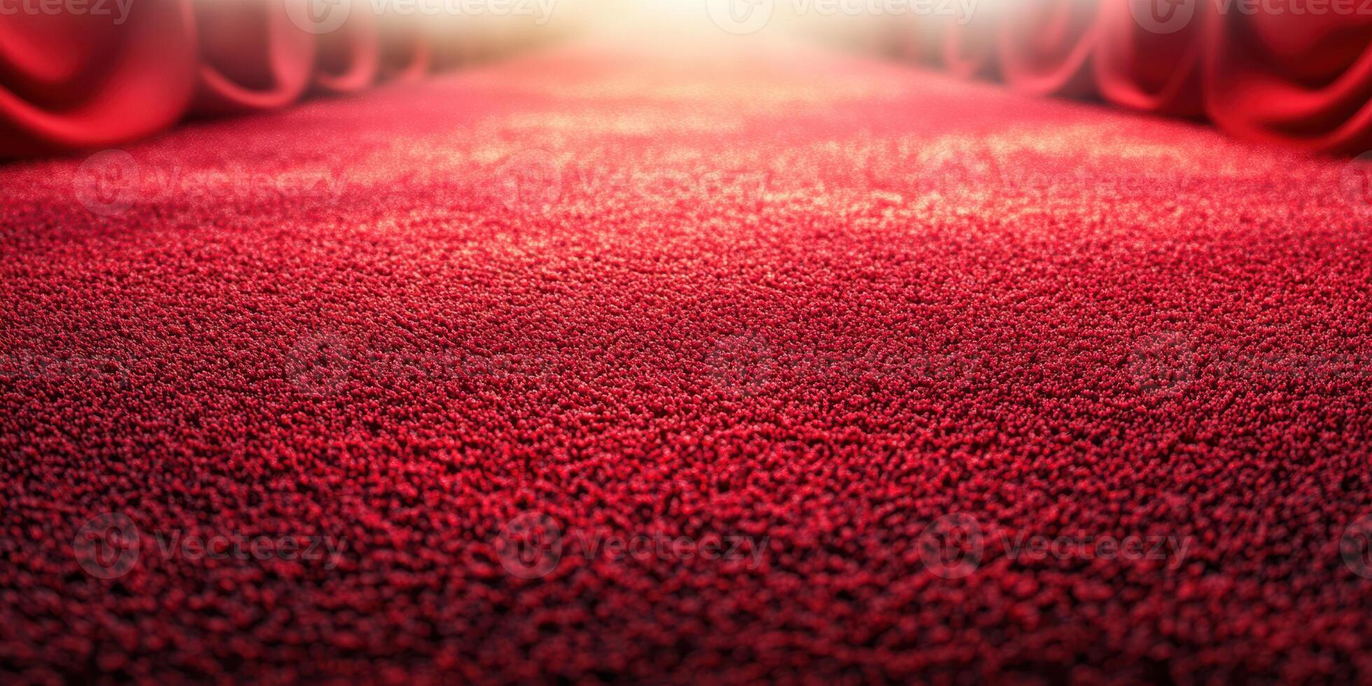 Red carpet leading to a stage with draped curtains in a venue, inviting guests for a special event photo