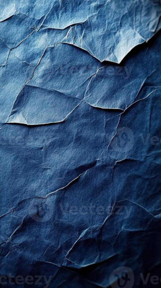 Crumpled blue paper creates a textured backdrop for creative projects and artistic designs photo