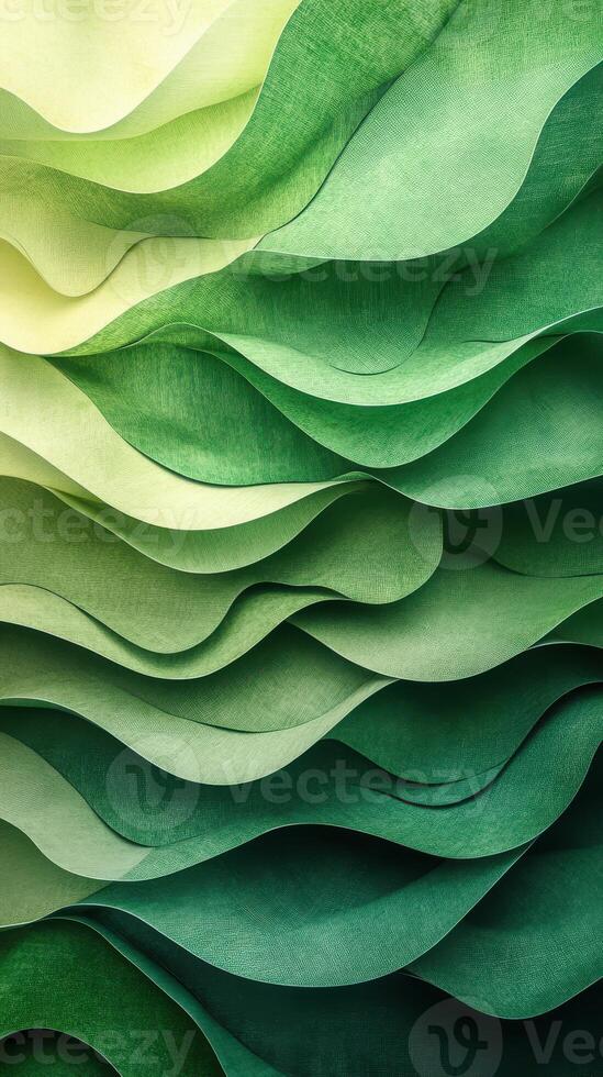 Colorful layered paper texture creating a flowing wave effect in varying shades of green and yellow photo