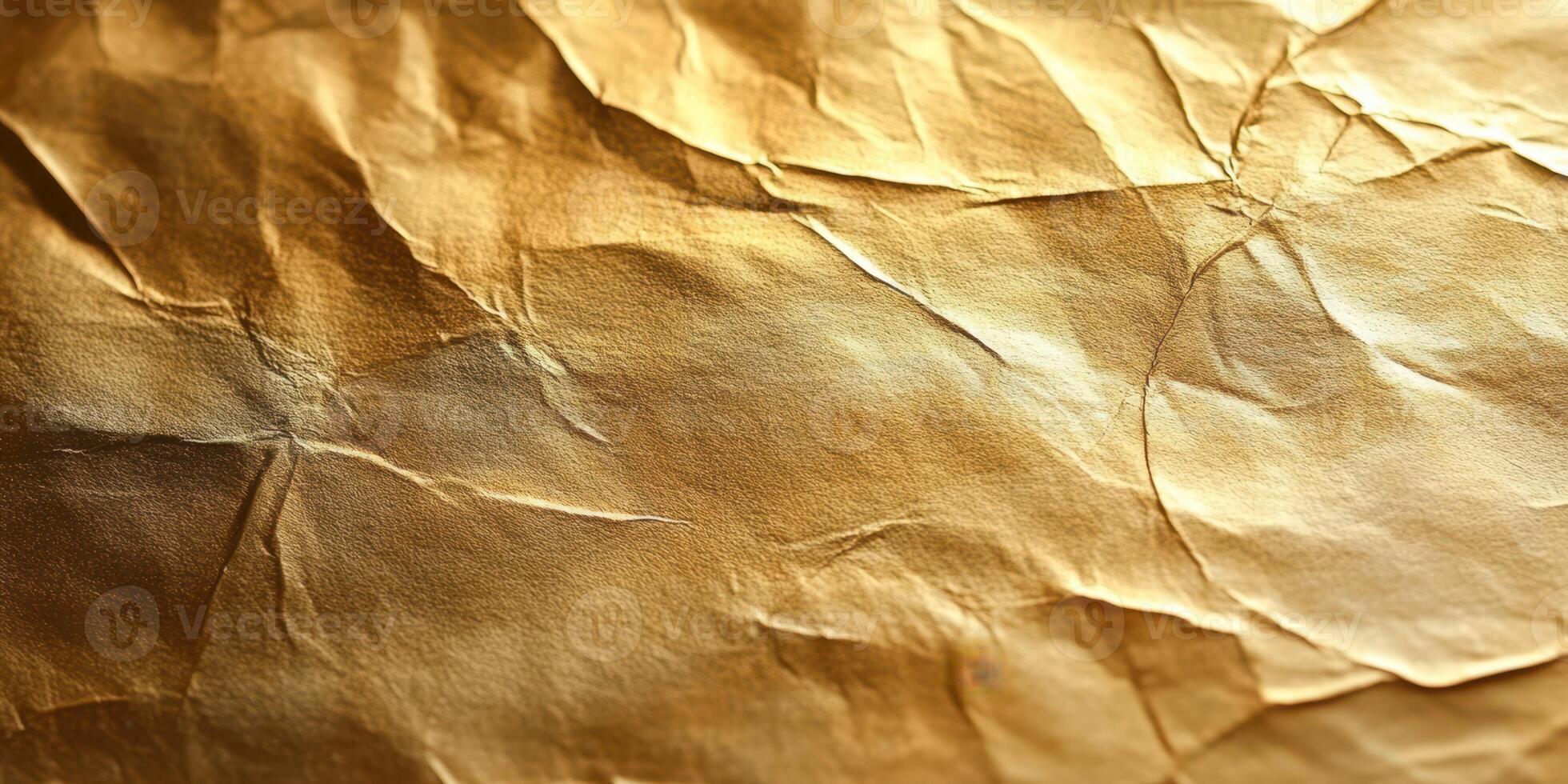 Textured golden paper with creases showcasing a rich, metallic sheen in soft lighting photo