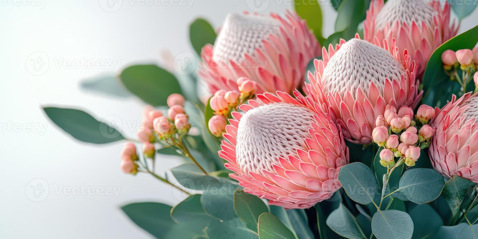 Beautiful bouquet of pink protea flowers with greenery arranged artfully for a fresh and vibrant display photo