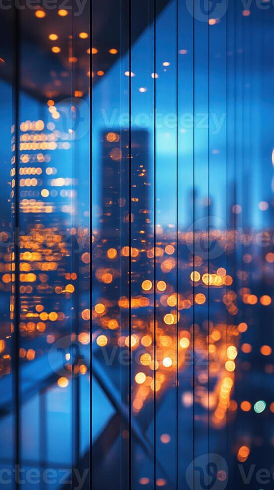 City skyline illuminated by vibrant lights at dusk viewed through glass window reflections photo