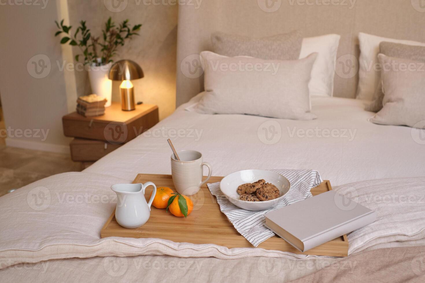 Tray with breakfast on bed photo
