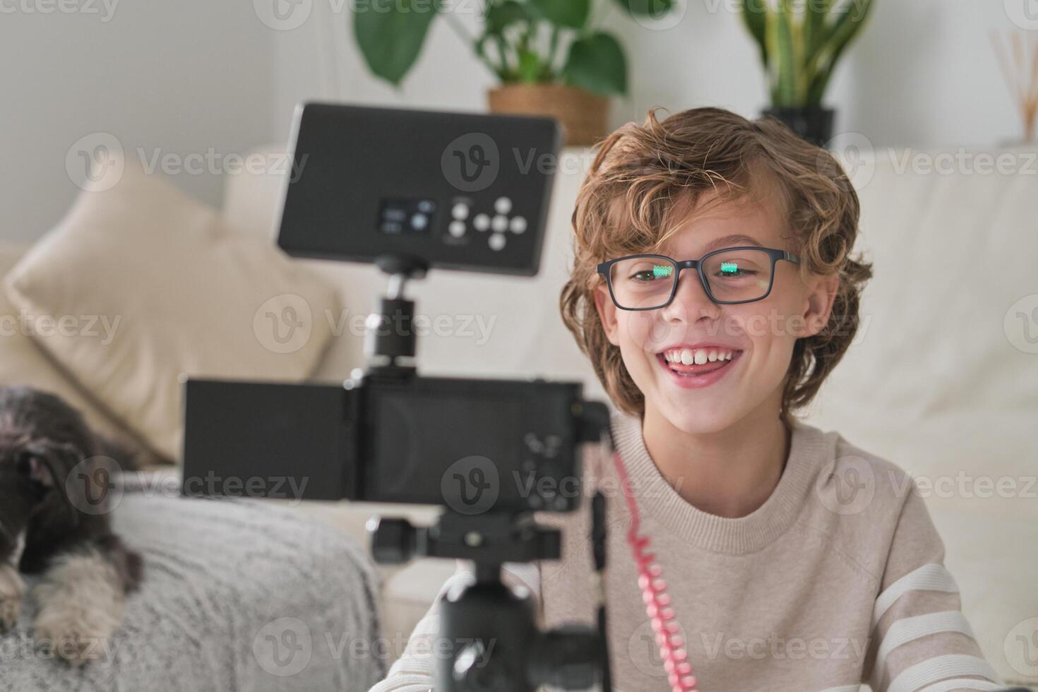 Preteen blogger shooting for social media at home photo