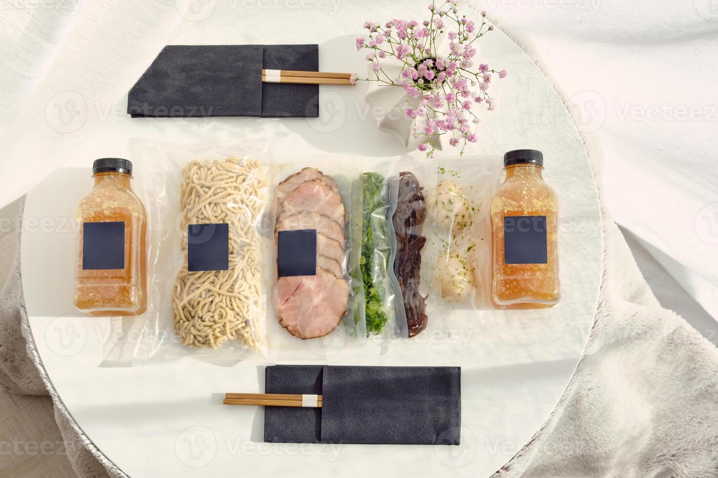 Ingredients for ramen soup preparation in vacuum bags photo