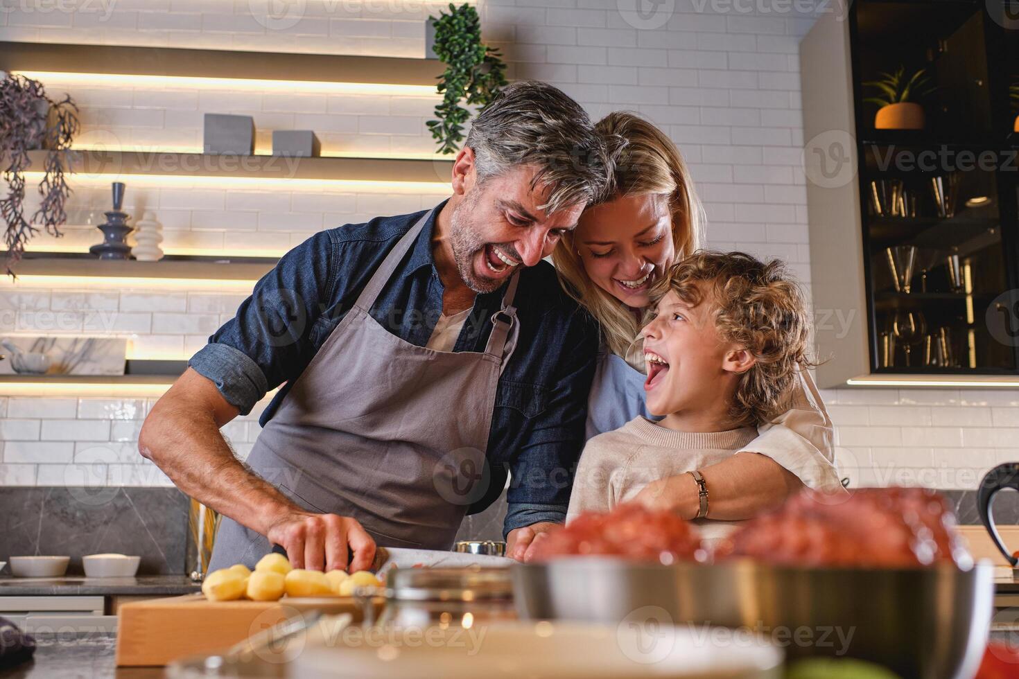 Family having fun while cooking photo
