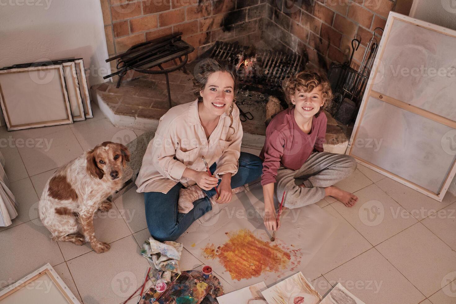 Happy sister and brother painting together photo