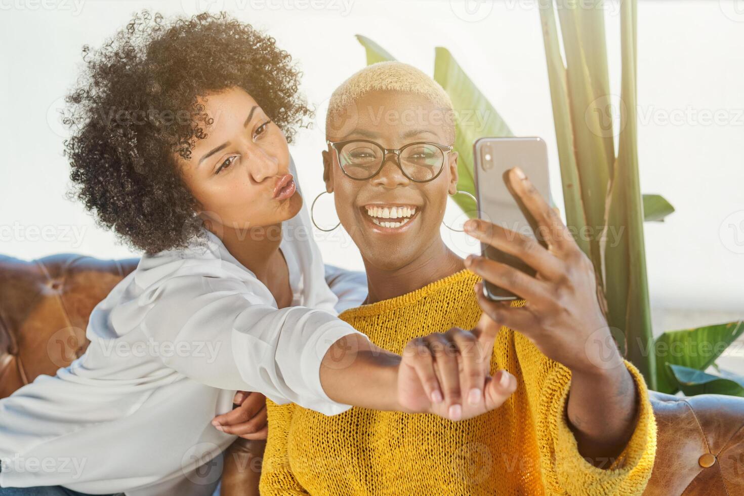 Diverse women having fun and taking selfie photo