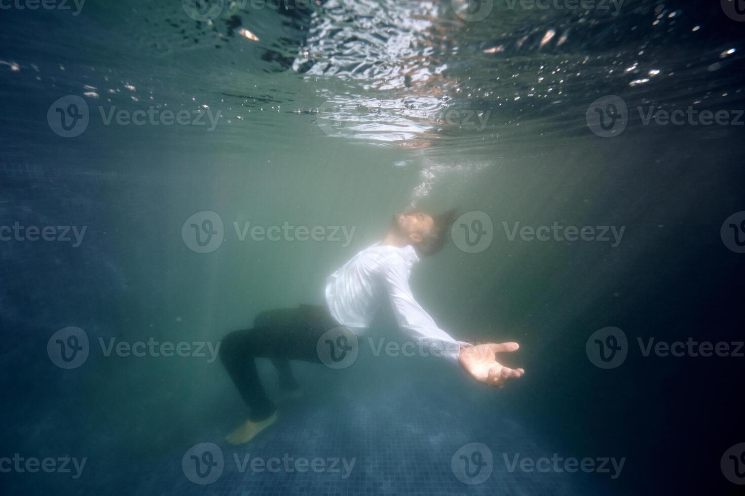 Lonely man drowsing in pool photo