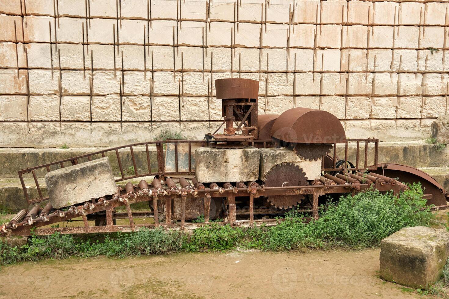 Old machine for making stones photo