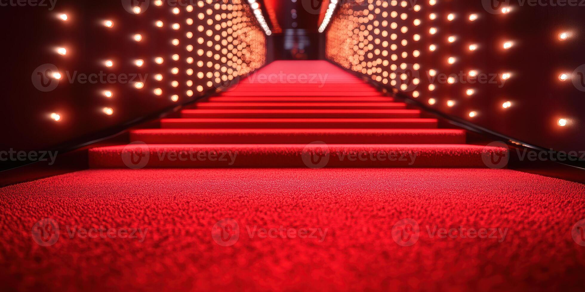 Red carpet hallway leading to a glamorous event location with bright lights illuminating the steps photo