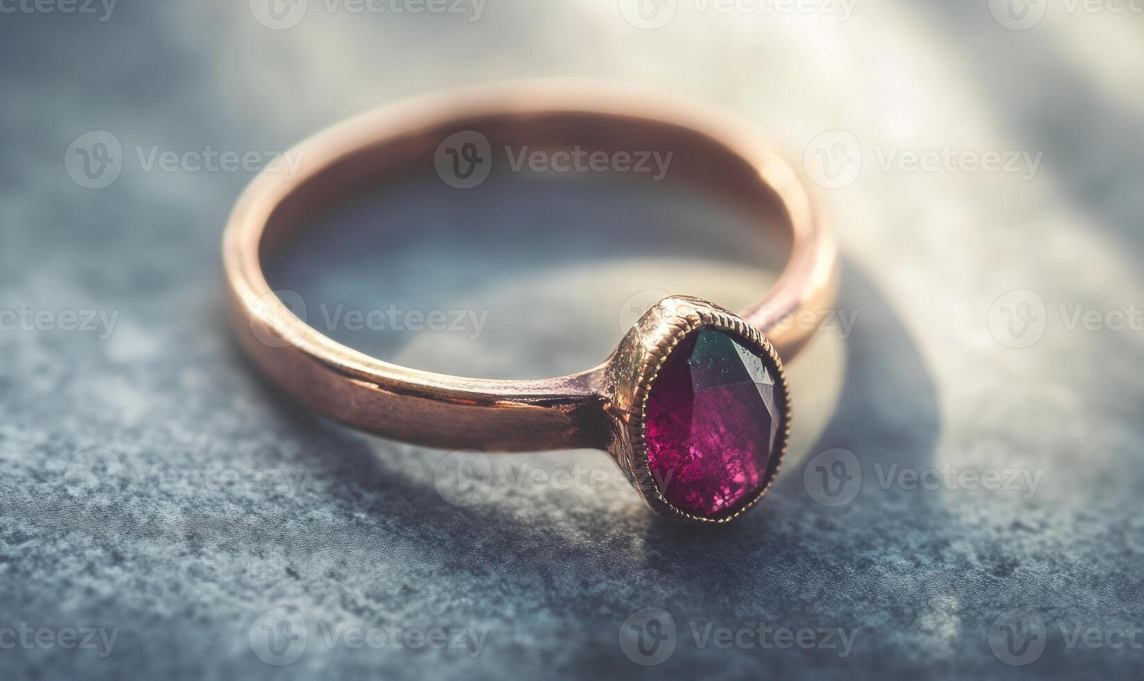 A ring with a ruby stone in the center photo