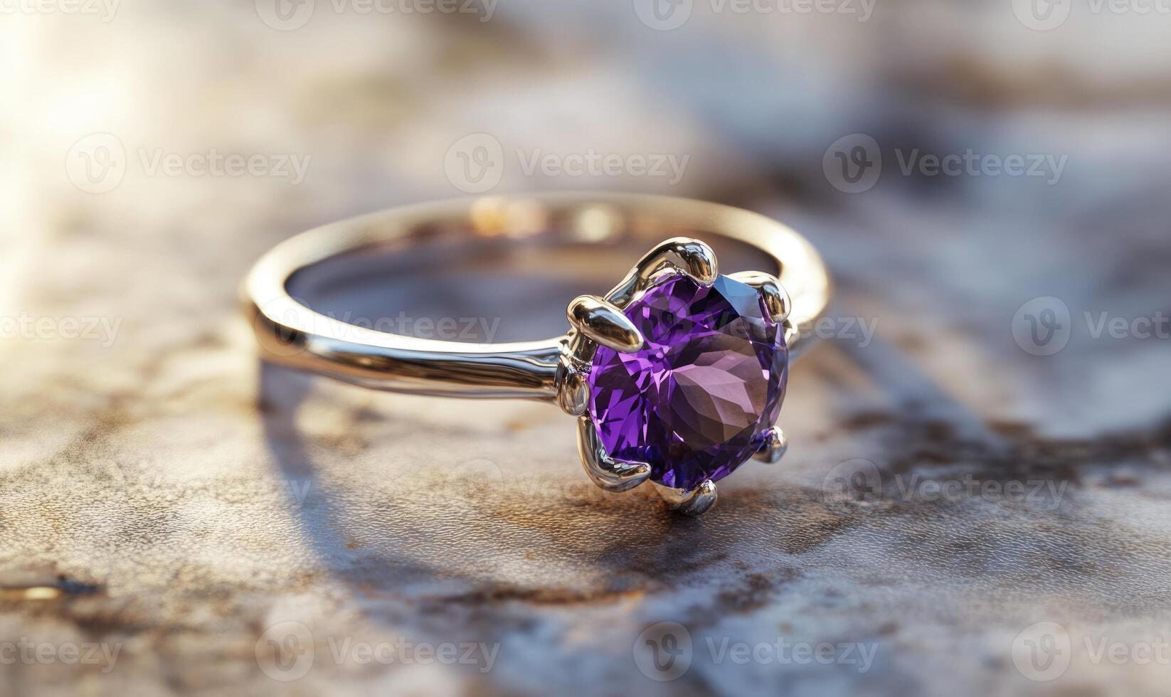 a purple stone ring sits on a marble surface photo