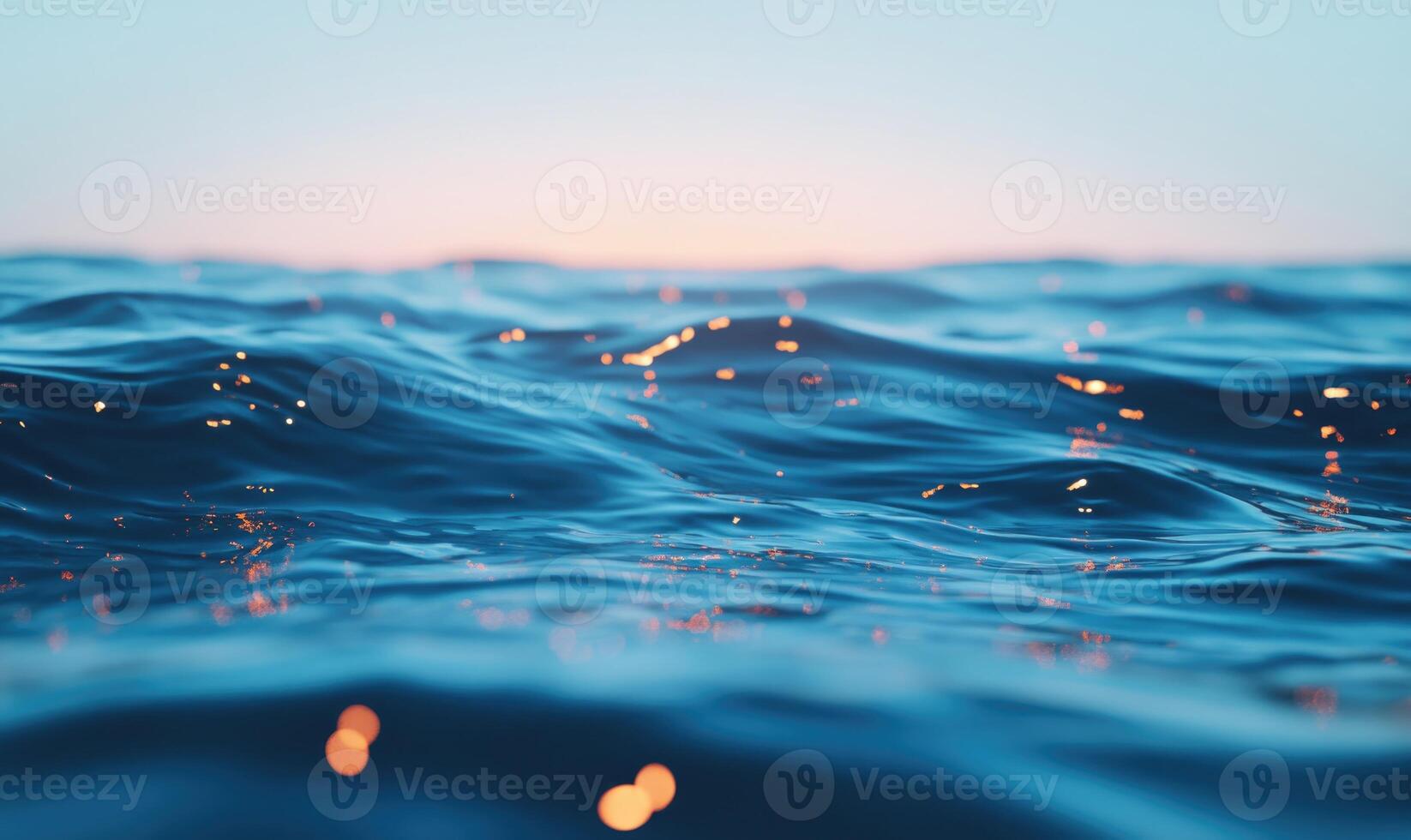 water surface with sparkling lights in the background photo