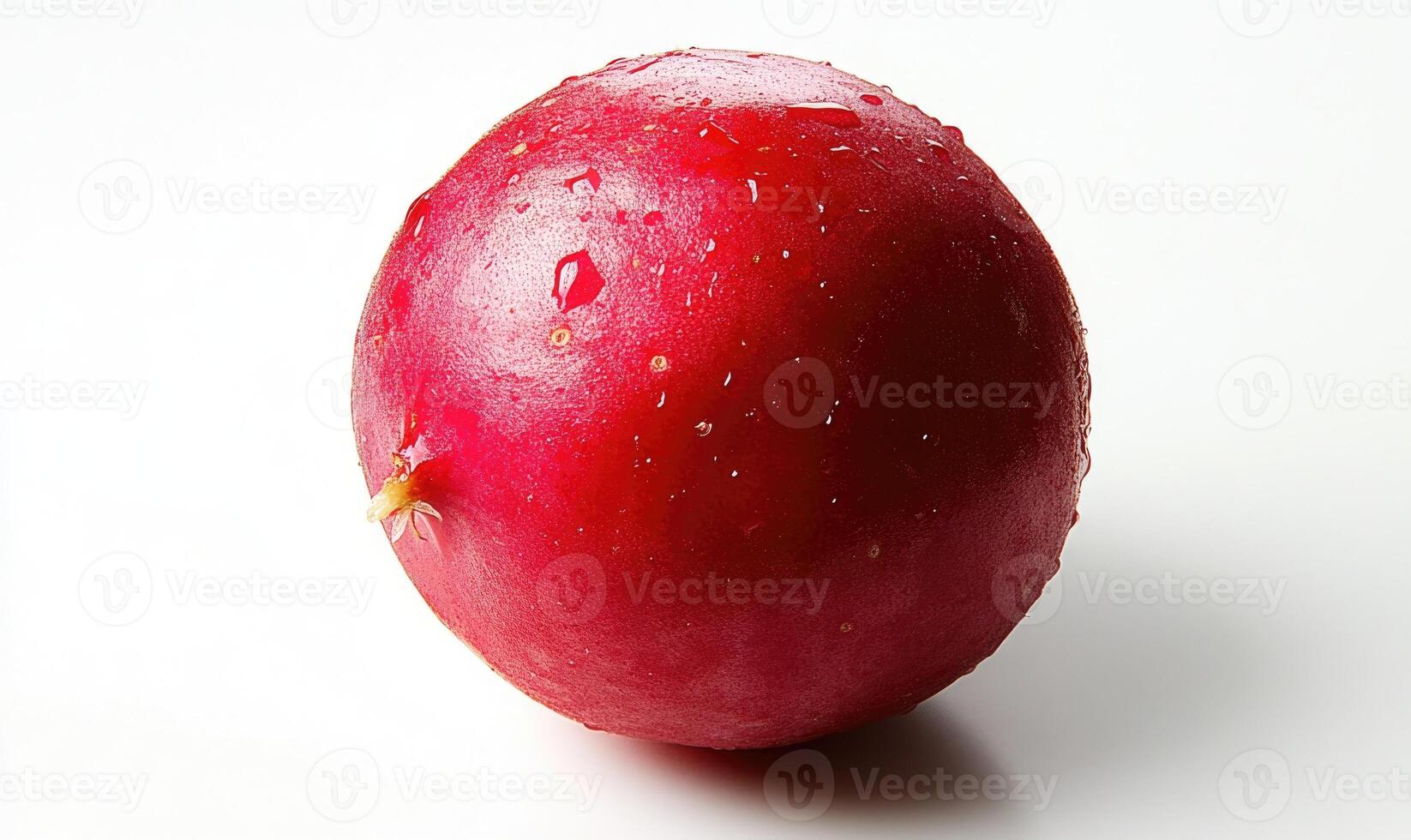 A red fruit with a stem on top photo