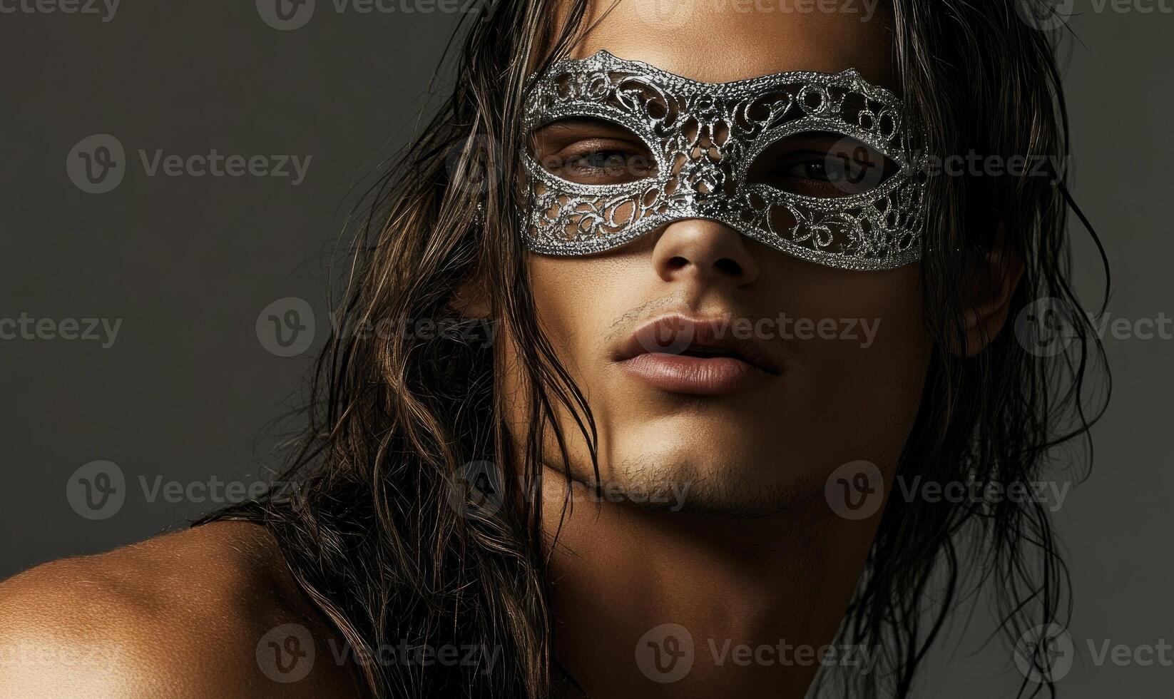 A man with long hair and a mask on his face photo