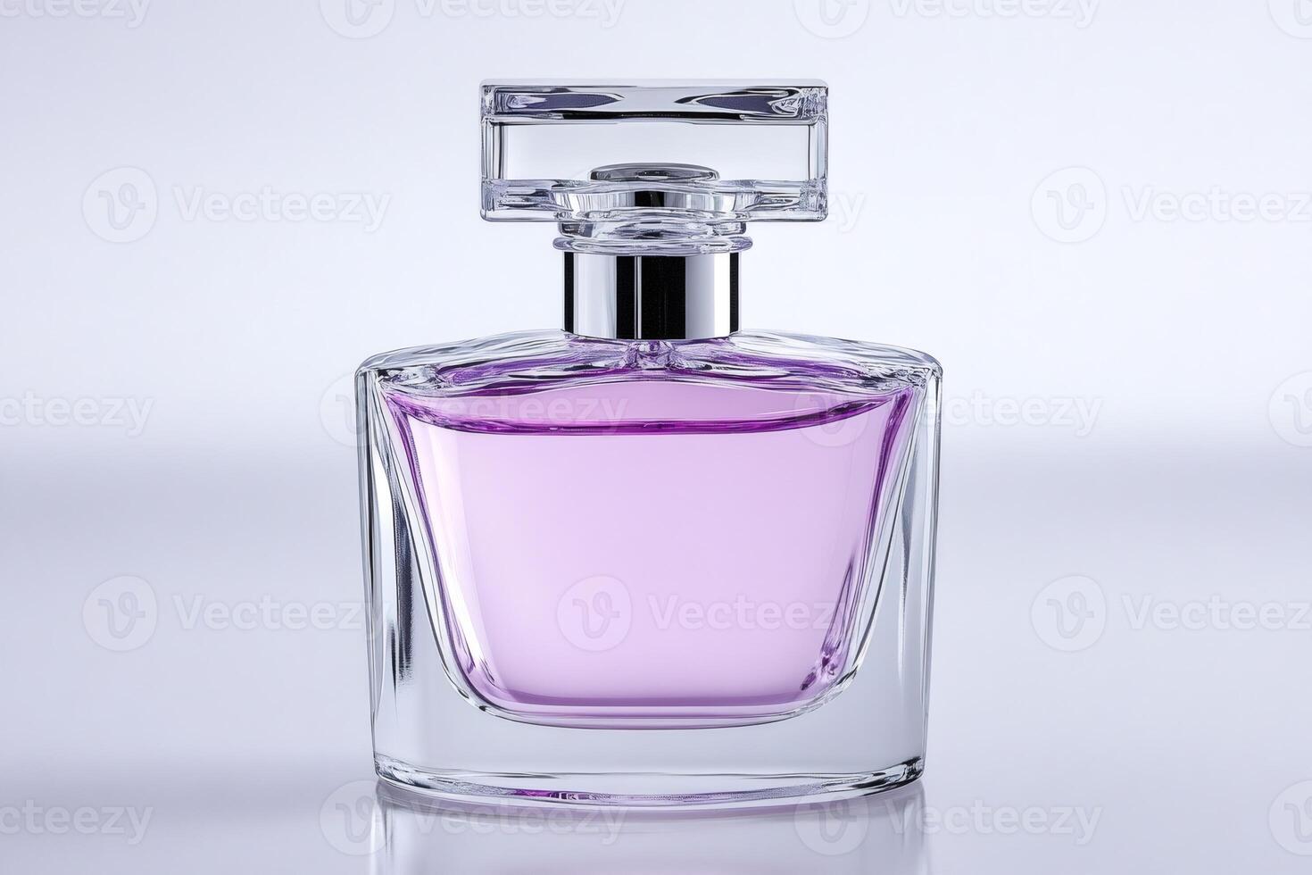 Elegant glass perfume bottle with purple liquid on reflective surface photo