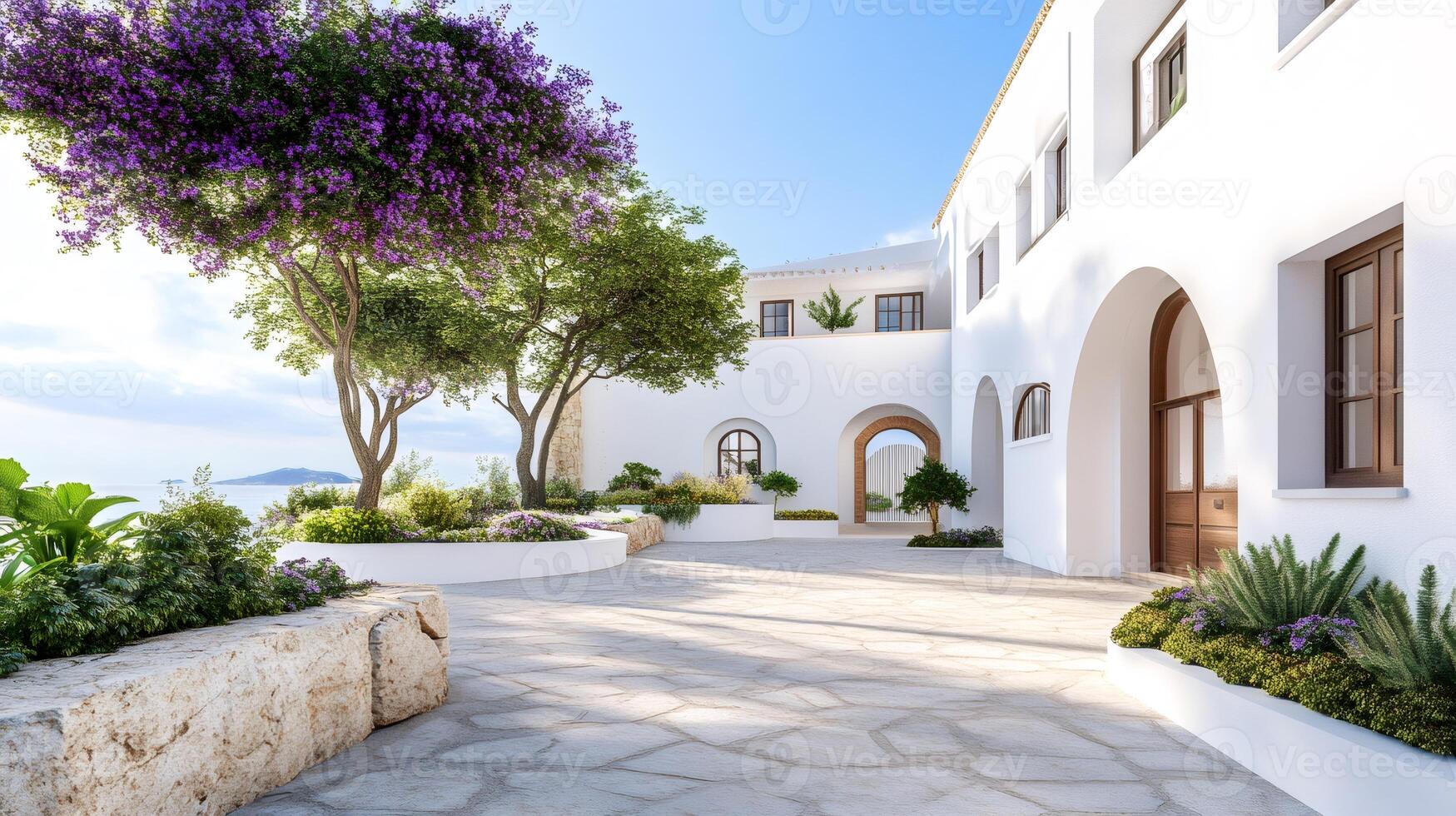 Blooming jacaranda trees decorating luxury whitewashed Spanish villa with sea view photo