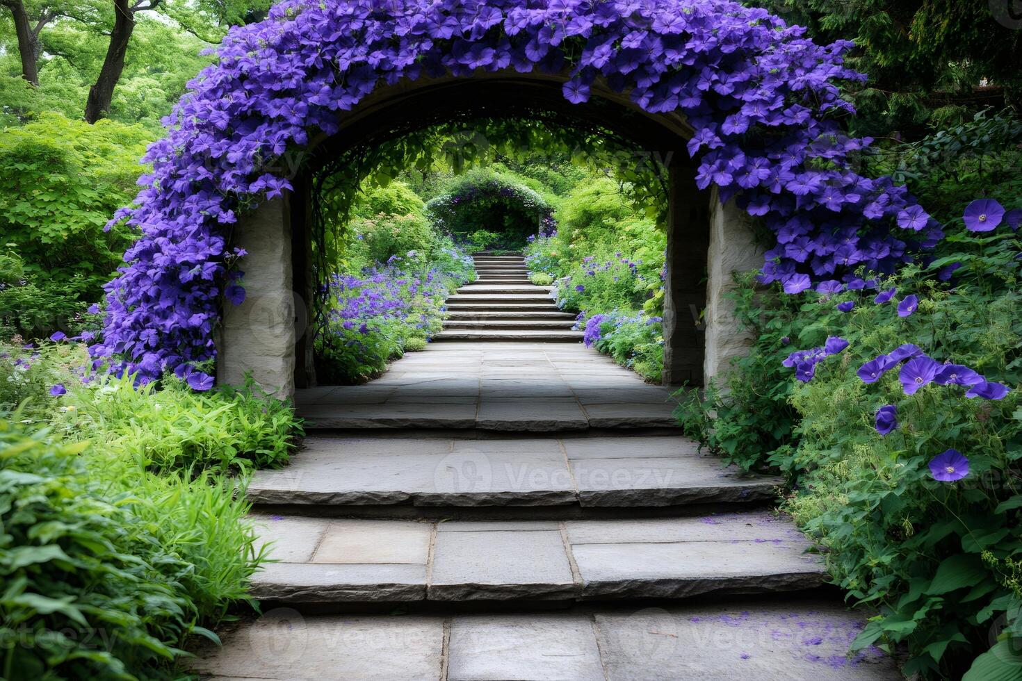 Purple flowers covering archway in beautiful garden with stone stairs photo