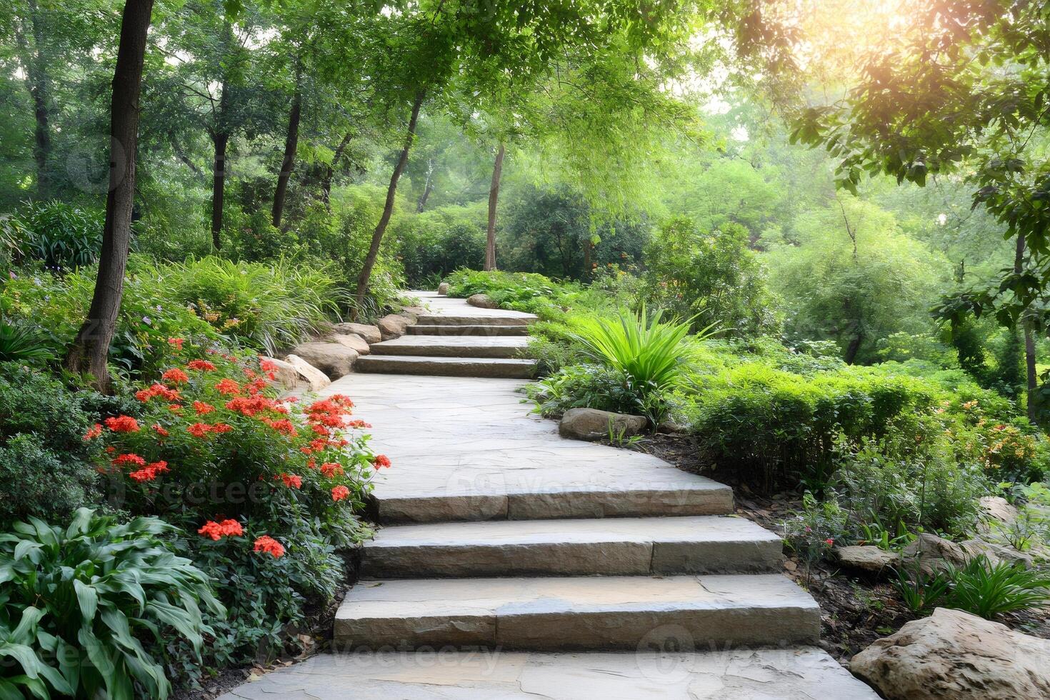 Stone paved path winding through lush green garden photo