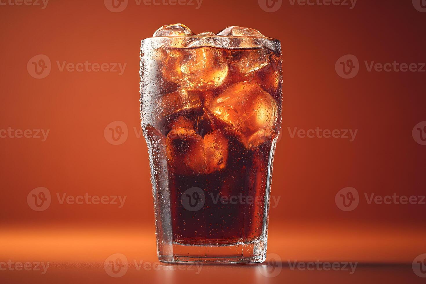 Refreshing Iced Beverage Against Orange Background for Summer Themes and Drink Promotions photo