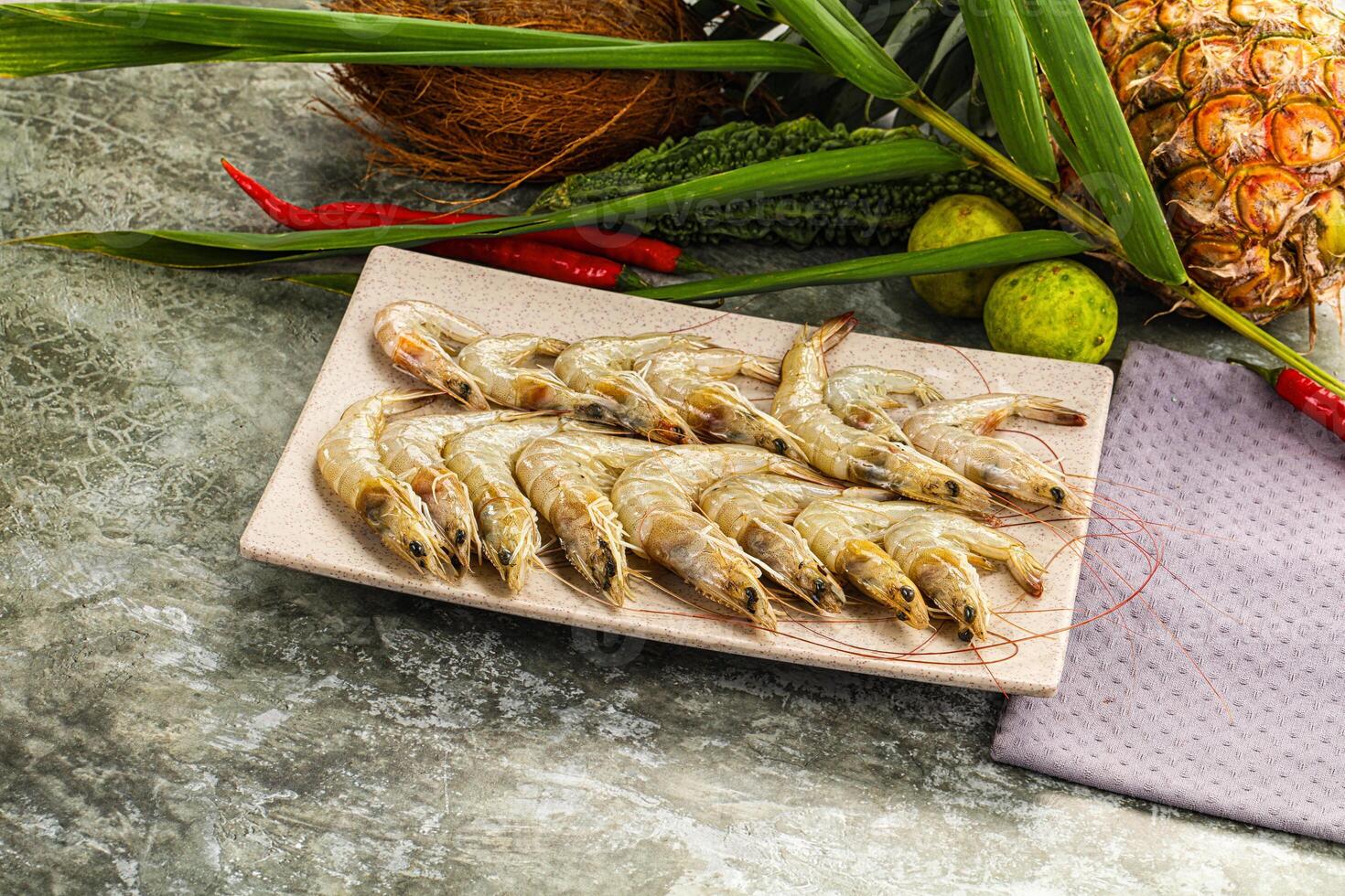 A plate of shrimp and other vegetables on a table photo