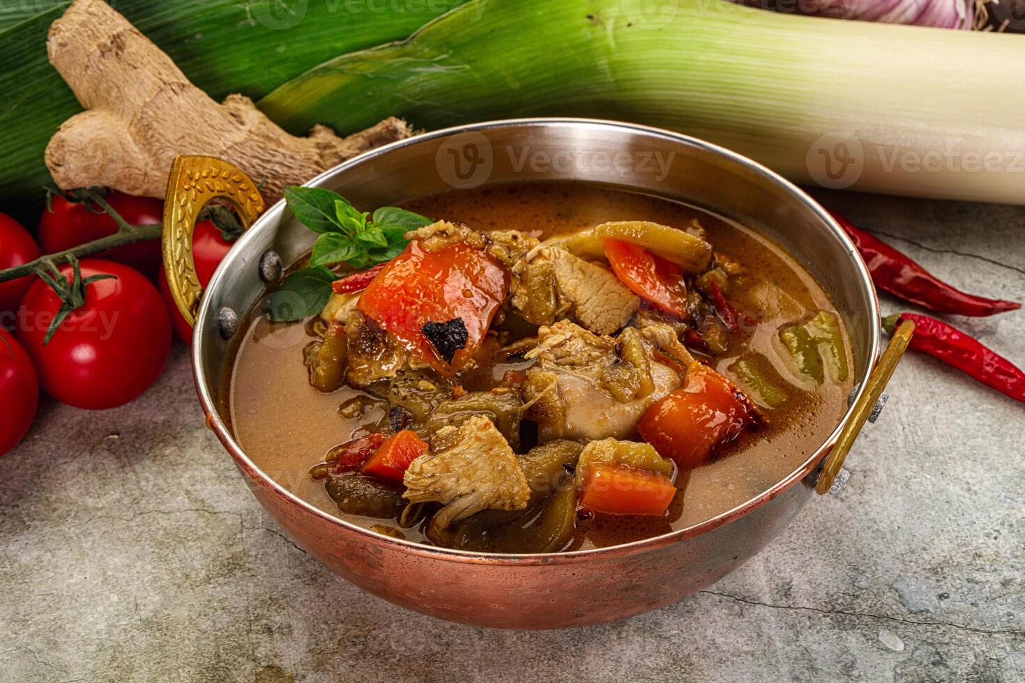 A bowl of stew with vegetables and spices photo