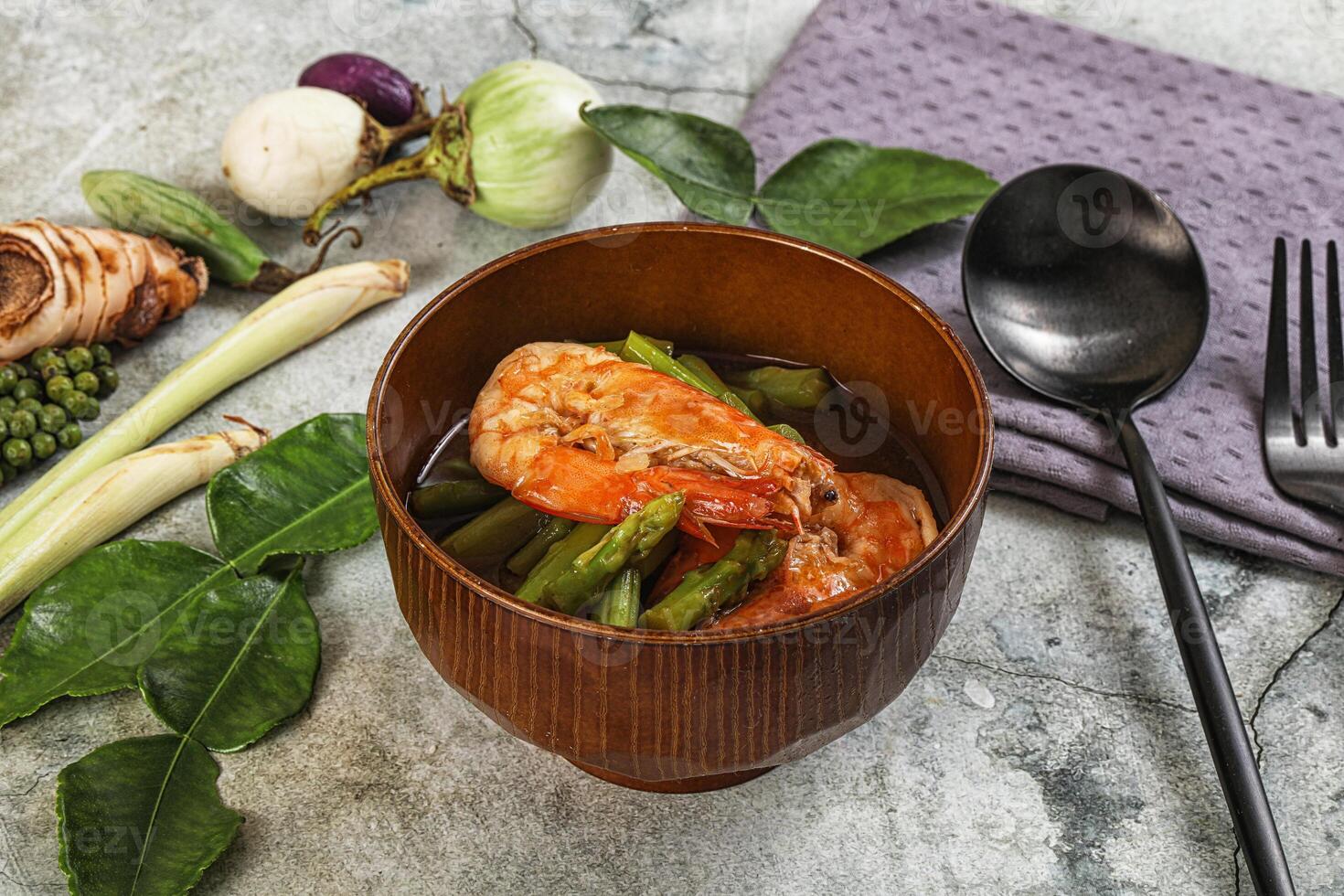 A bowl of food with shrimp and vegetables photo