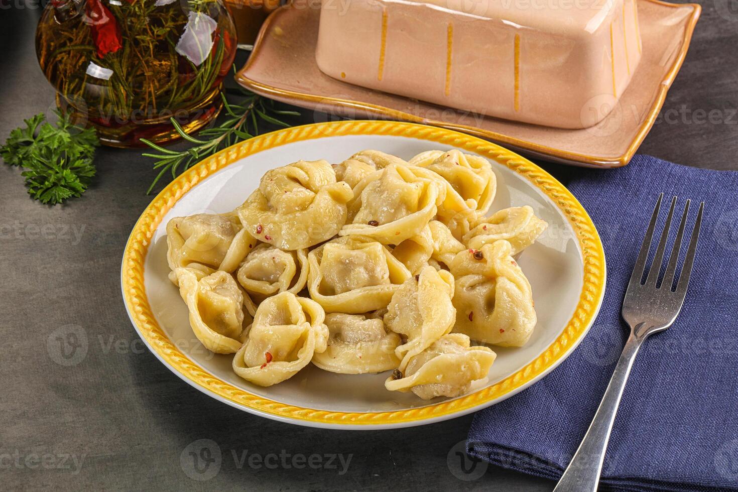 A plate of pasta with cheese and a fork photo