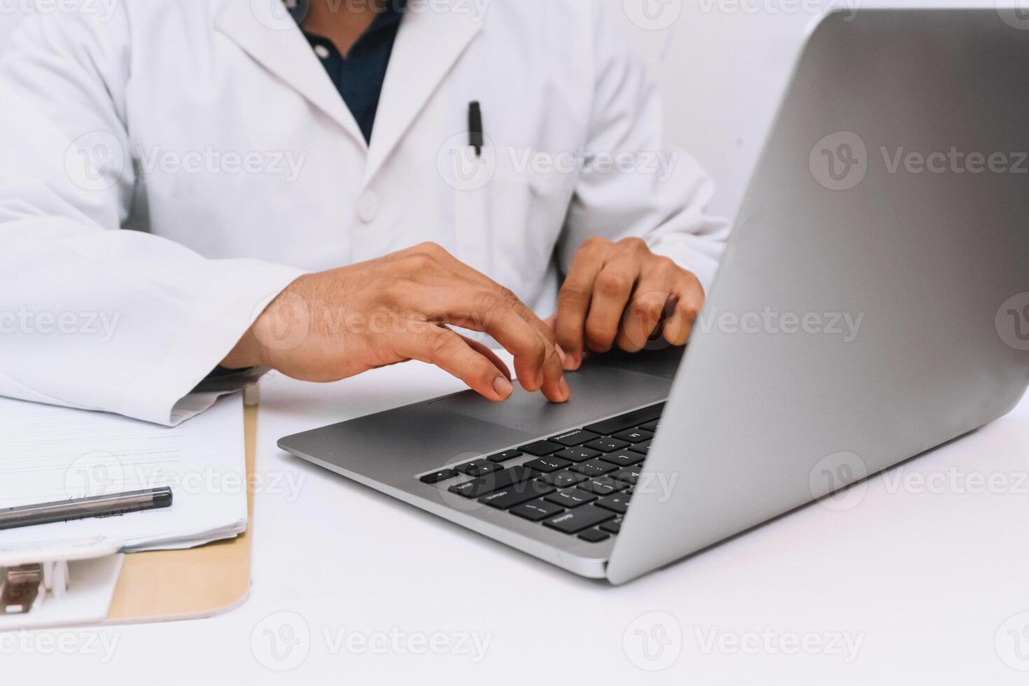 Hands of health personal with a laptop on a desk with a laptop. communication and medical technology concept. photo