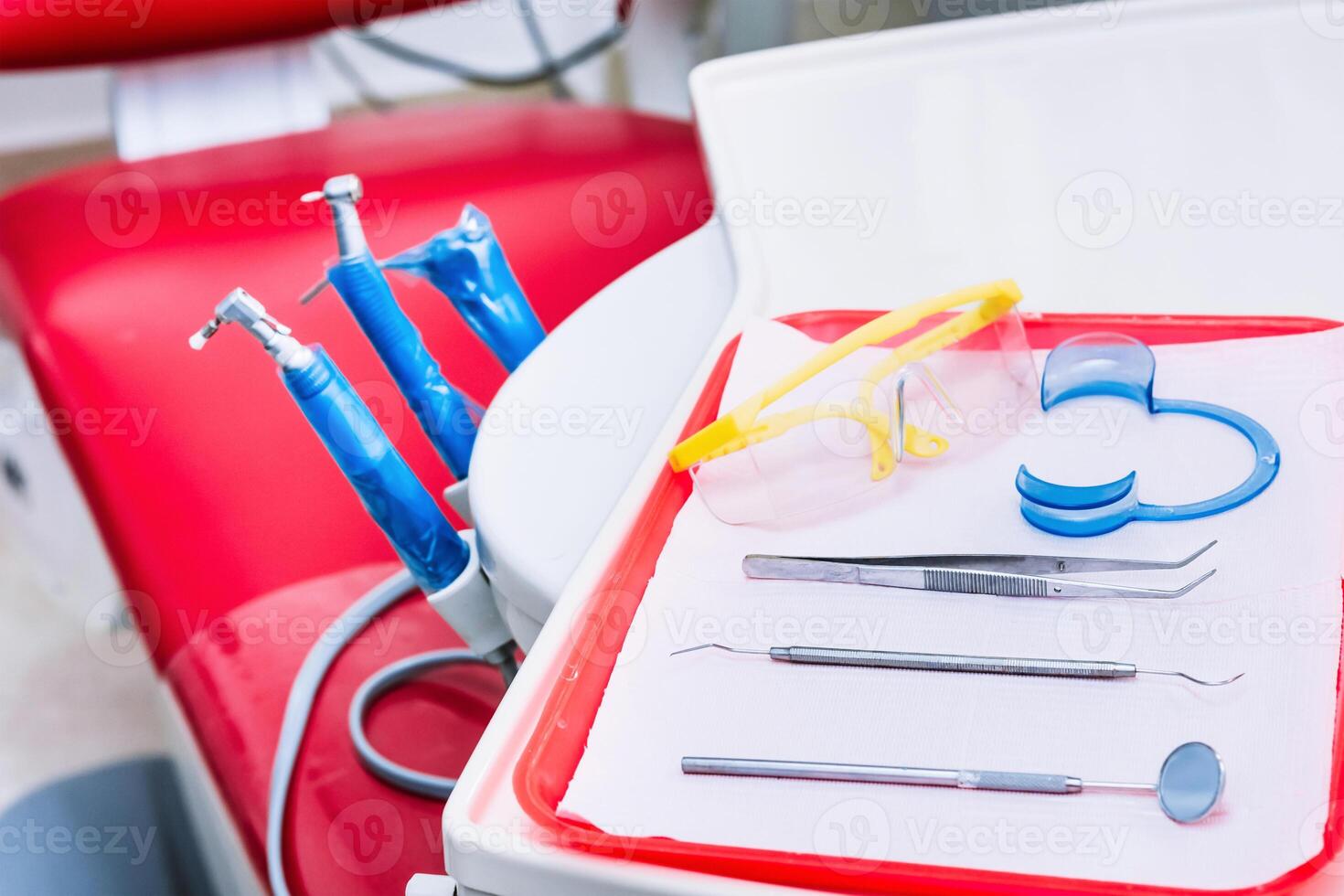 selective focus to dental instruments for oral revision. hygiene concept. photo