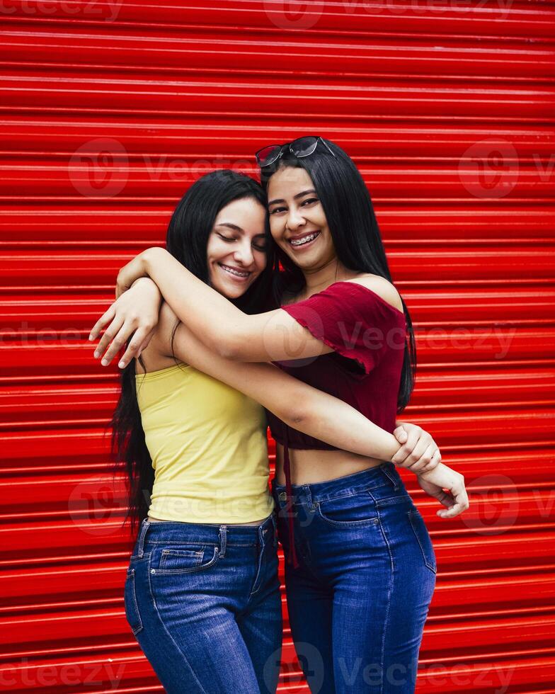Two sisters together looking at camera. photo