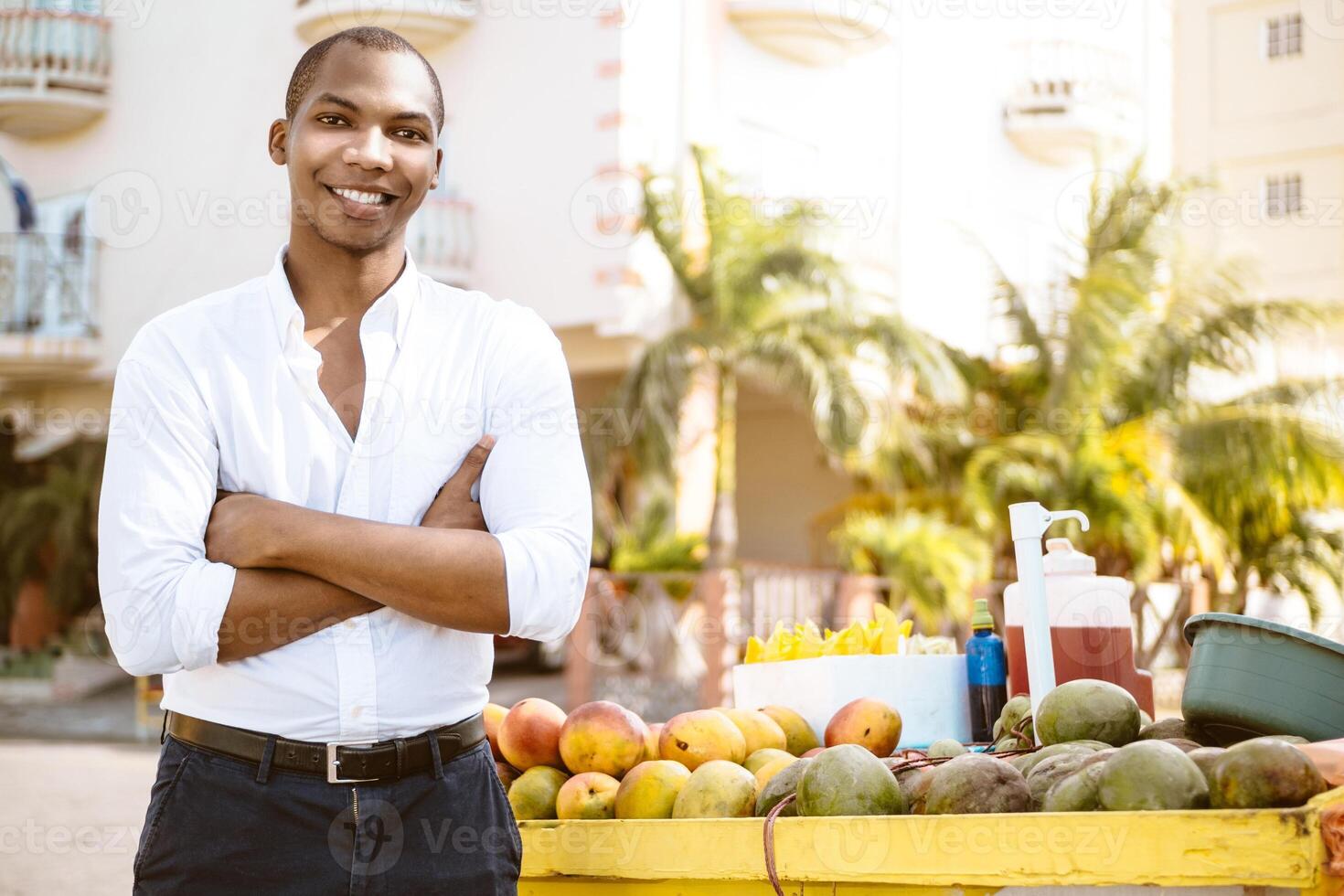 smiling black African man casual trader working on the street. entrepreneurial concept photo